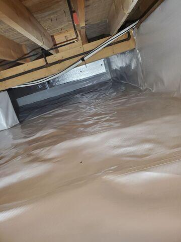 The crew installed the SilverGlo foam panel insulation and CleanSpace crawl space encapsulation liner.