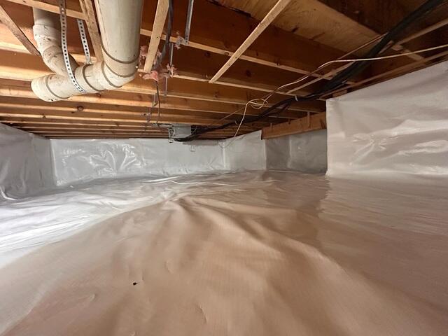 CleanSpace Encapsulation System - A durable crawl space liner installed across the floor and walls to block ground moisture and create a cleaner, more controlled environment.