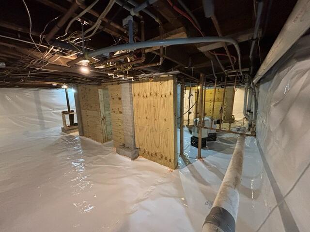 CleanSpace Wall System - A durable basement wall system that creates a clean, bright appearance while directing moisture from the foundation walls into the waterproofing system below.