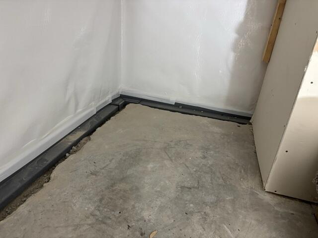 During: Our Foreman, Nanga, and his crew worked hard to secure all the waterproofing products throughout the basement.