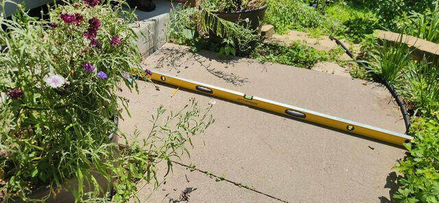 The walkway where it had sloped due to soil settlement