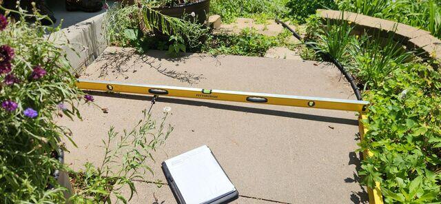 How much the slab would need to be lifted in order for it to be level