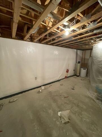 During: Our Foreman, Aaron, and his crew recommended securing several waterproofing products throughout the basement.