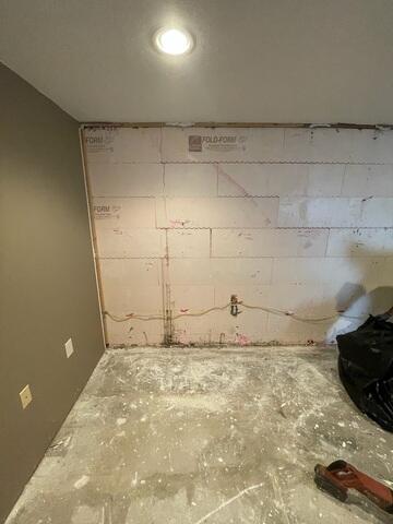 Before: Our Design Specialist, James, recommended securing all the products throughout the basement.