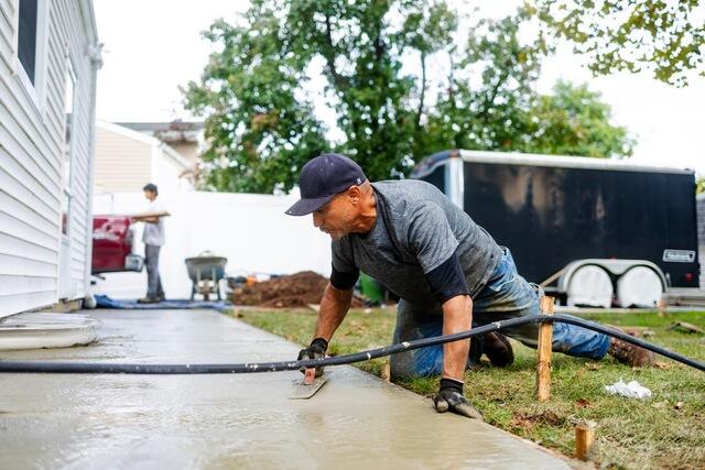 With the old, settled concrete removed and the SunHouse installed, the team replaced the entire sidewalk and walkway with brand-new concrete. The completed surface gives the Edison home a completely refreshed walkway where the previous slabs had settled one to two inches.