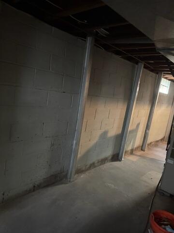 Our crew installed PowerBraces, securing them to the floor and floor joist.