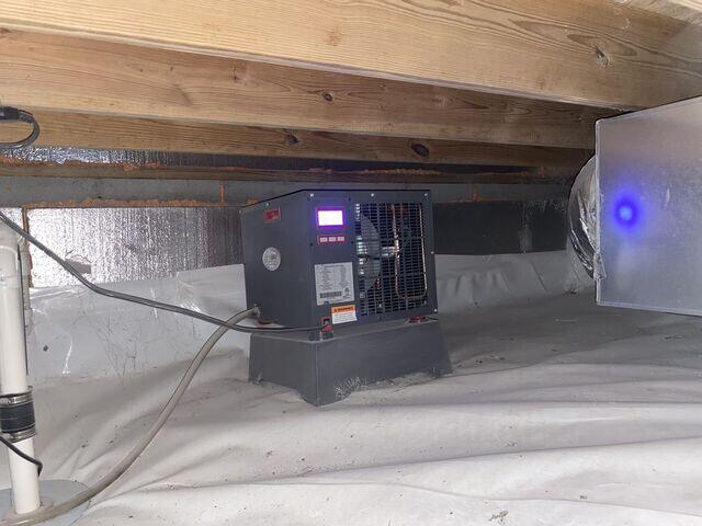 A SaniDry dehumidifier to control moisture in the space and prevent mold growth.