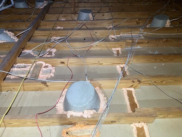 Installed can light covers and completed air sealing.