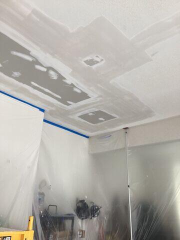 During: New drywall installed over the open ceiling sections, with seams and fasteners prepared for finishing.