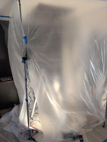 Plastic containment installed around the work area to help protect the room and surrounding surfaces during the ceiling repair.