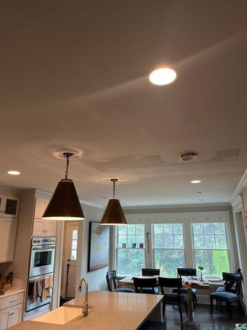 Repaired ceiling finished and painted, with the patched area blended into the surrounding ceiling.