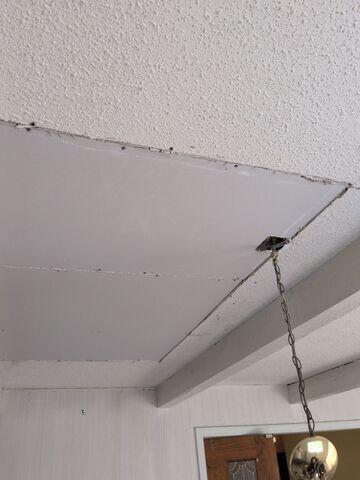 New drywall installed to close the ceiling opening.