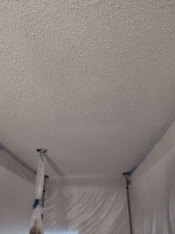 Popcorn texture applied across the repaired section.