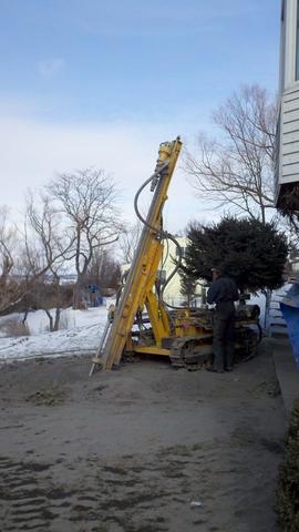 Here we are doing some work adding this geothermal system. Now that the system is complete, this home is considered a net zero home!