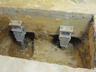 Brackets attached to the column footings