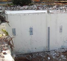 Post demolition basement wall with three helical tiebacks and one Geo-Lock anchor through a pilaster View