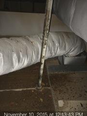 Above drop ceiling with debris.