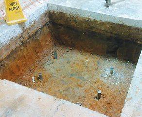 One of six pile cap excavations with HA175 helical piles installed