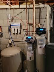 AFTER: New EVRS-1044 water softener, EVFE-1252 iron filter and UltroWater Reverse Osmosis drinking system. We were able to take out blue in-line filters, as they were no longer needed.