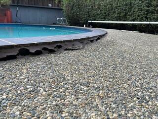 An additional before image of the sinking pool deck and uneven surface.