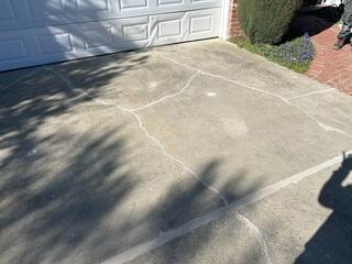 Additional image showing the lifted and sealed driveway.