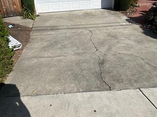Additional wider image of the cracking and settlement on the driveway of this Orinda home.