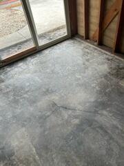 Before image showing cracking in this homes slab foundation.