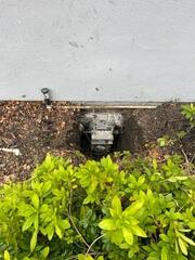 Progress image showing another installed push pier waiting for lift procedures and backfill.