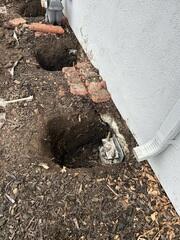 Progress image showing and installed pier awaiting the hydraulic lift procedure and backfill.