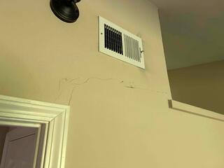 Additional before image with another example of the cracking in the homes interior.