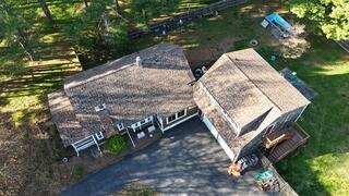 The transformation is complete! The new IKO Dynasty shingles in Chestnut, combined with our underlayment system, provide not only a stunning finish, but also maximum protection for Merrily's home and garage. Now, with the roof fully replaced, she can rest easy knowing her property is safe and secure for the long run.