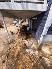 Beneath this deck, the crew had to dig most sections by hand due to the lack of access for the excavator. They dug down to gain access to the foundations footing.