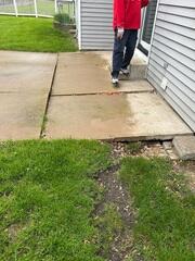 The slabs have begun sinking causing it to lean into the center