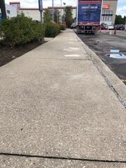 Through expert leveling, the sidewalk now presents a smooth, consistent plane, ensuring pedestrian safety and improving the property's overall aesthetic.
