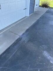 During: Our Foreman, Jordan, and his crew lifted and leveled the sidewalk back into place.