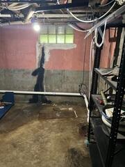 Before: Our Design Specialist suggested waterproofing the entire basement.