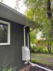 After: Jackson, our Radon Sales & Service Technician, installed the system outside the home.