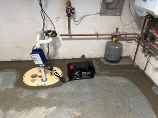 To provide complete protection against water intrusion, our crew installed TrenchDrain to stop surface water at entry points, the WaterGuard System to capture wall and floor seepage, and the TripleSafe Sump Pump for powerful, reliable water removal.