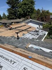 The Installation process of a Klaus Roof. The team used Dynasty IKO Asphalt shingles on this roof project.