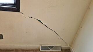 Worsening cracks like these on interior walls were a clear sign of foundation settlement, prompting this Moline, IL homeowner to seek our expert solution.