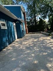 The lifted concrete looks seamless, restoring both function and curb appeal to this backyard space.