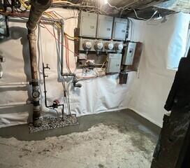 The CleanSpace Wall System is seamlessly installed along the basement walls to protect them from water damage and it directs any water it encounters into the WaterGuard drainage system. The WaterGuard lines the perimeter of the floor collecting groundwater and it is covered in fresh concrete.