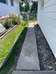 During: Our Foreman, Charlie, and his crew successfully lifted the sidewalk back into place.