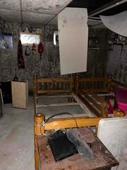 The before photo of this property shows mold and moisture soaked ceiling and wall tiles.