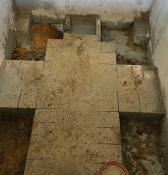 Elevator shaft with floor removed at underpinning locations