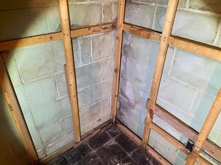 Efflorescence can be seen along the corner of the walls