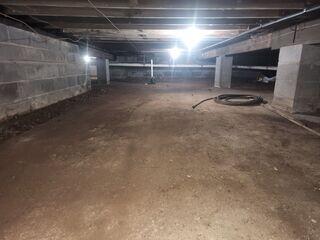 The crawl space in Paramus, NJ showed clear signs of moisture buildup, poor insulation, and potential mold risk, leading to musty odors and indoor air quality concerns.