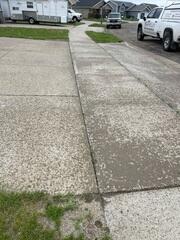 During: Our Foreman, Charlie, and his crew successfully lifted the driveway back to its original position.