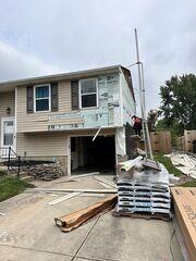 Siding Replacement: Here we are replacing the siding, making sure our vapor barrier is properly sealed against the home beforehand.