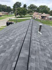 Roof Replaced: This is what the roof looked like after we replaced it with our IKO Dynasty Class 3 laminated shingles in the "granite" colorway.